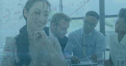 Diverse professionals analyzing financial charts in office setting