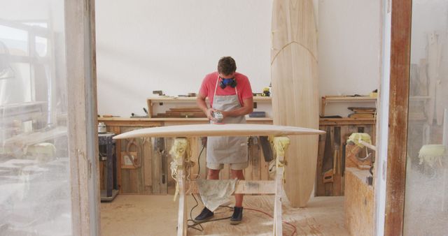 Carpenter Crafting Custom Surfboard in Workshop - Download Free Stock Images Pikwizard.com