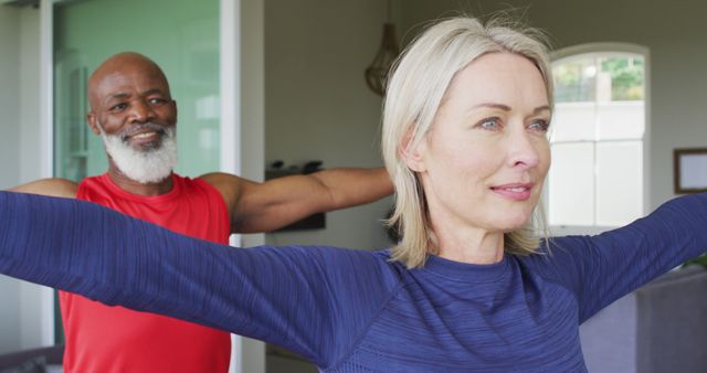 Senior couple engaging in yoga exercises at home. Perfect for promoting fitness, wellness, active aging, and home workout routines. This image highlights the importance of maintaining health and happiness through physical activity.