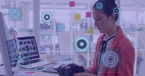 Asian Businesswoman Analyzing Data with Digital Connections Interface