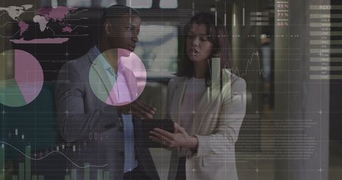 Business Professionals Analyzing Digital Data Visualizations in Office