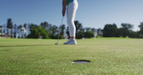 Female Golfer Preparing Shot on Sunny Day Outdoors - Download Free Stock Images Pikwizard.com