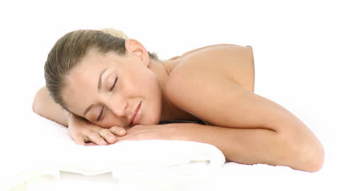 Relaxed Woman Enjoying Therapy in Spa Setting