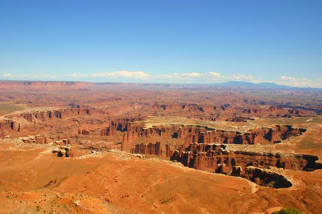 Breathtaking view of Canyonlands National Park, showcasing iconic rock formations and vast desert landscape. Ideal for travel websites, nature blogs, educational materials about geological formations, and tourism industry advertisements.
