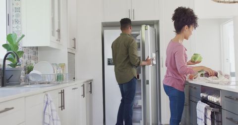 Couple Preparing Meal Together in Modern Bright Kitchen - Download Free Stock Images Pikwizard.com