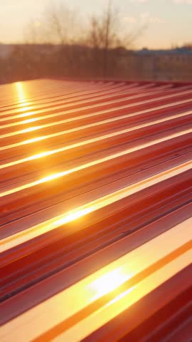 Vertical Video of Sunlight Glinting on Corrugated Metal Roof Reflecting Golden Lines