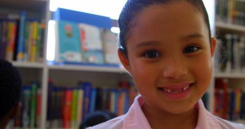 Smiling Schoolgirl in Colorful Library Environment