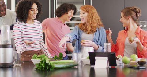 Group of Friends Joyfully Making Smoothies in Kitchen - Download Free Stock Images Pikwizard.com