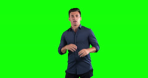 Businessman Presenting in Front of Green Screen Background