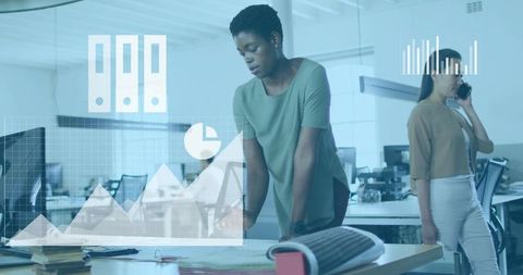 Woman analyzing digital analytics overlay while planning project in open office