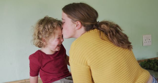 Mother Kissing Laughing Son While Spending Quality Time Together - Download Free Stock Images Pikwizard.com