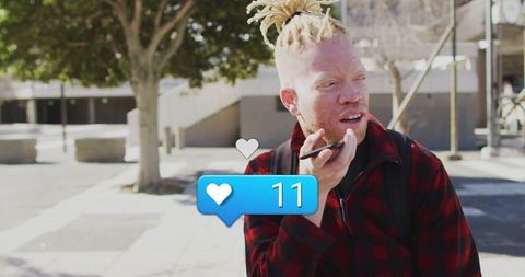 Man Engaging with Smartphone in City Hawing Conversation