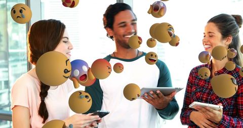 Friends Enjoying Social Media Interaction with Laughter and Emojis