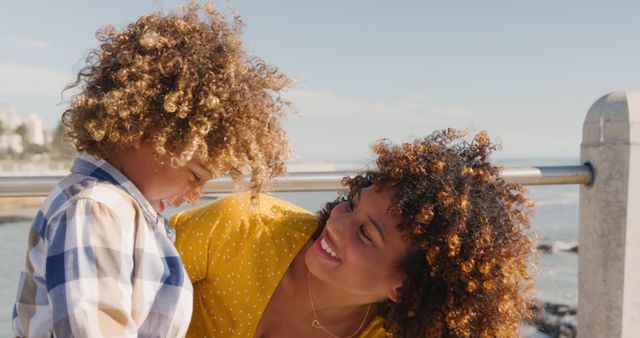 Happy Mother and Curly-haired Son at Seaside - Download Free Stock Images Pikwizard.com