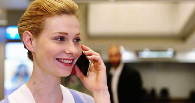 Professional Woman Talking on Smartphone in Office - Download Free Stock Images Pikwizard.com