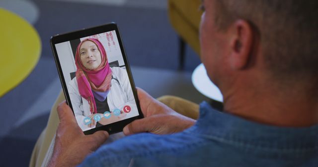 Video Call Consultation with Doctor Wearing Pink Hijab - Download Free Stock Images Pikwizard.com