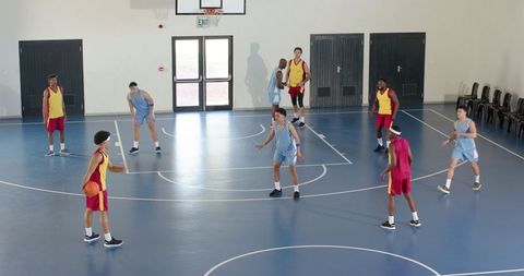 Diverse Basketball Game in School Gym Capturing Intense Competition