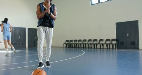 Athletic Players Practicing on Indoor Basketball Court