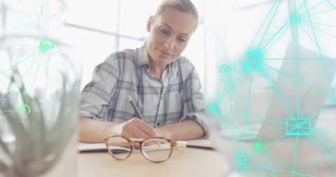 Professional Woman Writing Modern Office Digital Network Overlay