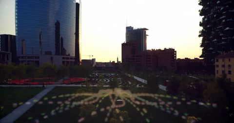 Urban cityscape at dusk with modern park paths and bokeh effect