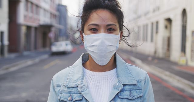 Young Woman Wearing Face Mask Walking in Urban Street - Download Free Stock Images Pikwizard.com