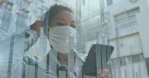 Asian Businesswoman Analyzing Smartphone Data with Protective Mask