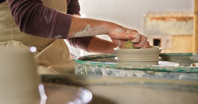 Potter's Hands Working on Ceramic Clay on Pottery Wheel Close-up - Download Free Stock Images Pikwizard.com