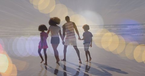 Family Enjoying Beach Walk with Sun Flares - Download Free Stock Images Pikwizard.com