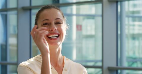 Smiling Businesswoman at Modern Office, Bright and Cheerful Mood - Download Free Stock Images Pikwizard.com