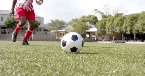Competitive Soccer Action on Campus Turf with Athlete Ready to Strike