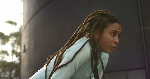 Exhausted Young Woman Resting After Urban Workout Session