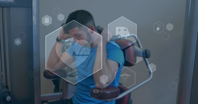 Young Man Exercising on Machine with Fitness Icons Overlay - Download Free Stock Images Pikwizard.com