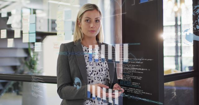 Female Professional Analyzing Data Through Transparent Screen in Modern Office - Download Free Stock Images Pikwizard.com