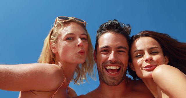 Group of Friends Enjoying Sunny Day Outdoors Smiling at Camera - Download Free Stock Images Pikwizard.com