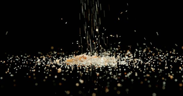 Slow Motion Salt Falling Against Black Background - Download Free Stock Images Pikwizard.com