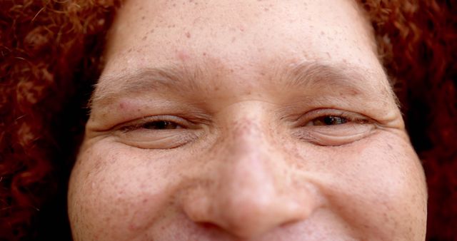 Close-up of Person with Freckles and Red Curly Hair Showing Eyes and Forehead - Download Free Stock Images Pikwizard.com