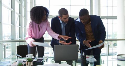 Diverse Business Team Collaborating on Laptop Project in Modern Office - Download Free Stock Images Pikwizard.com
