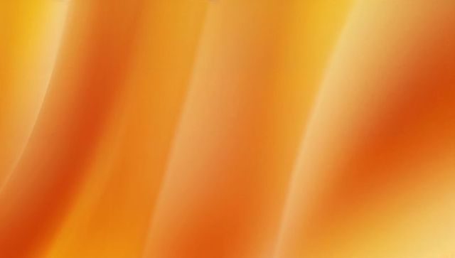 Glowing amber gradient background featuring smooth luminous bands for modern design