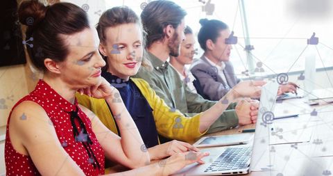 Diverse Team Collaborating with Digital Networking in Office