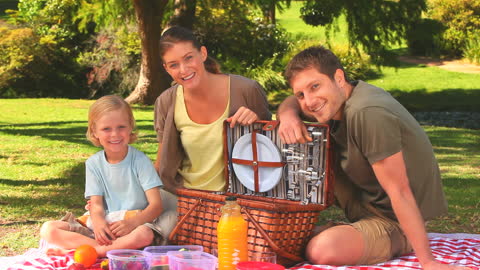 Happy Family Enjoying a Relaxing Picnic in the Park