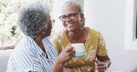Senior African American Women Enjoying Coffee and Conversation