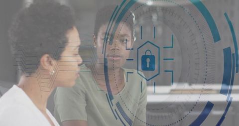 Female Professionals Analyzing Digital Security Interface