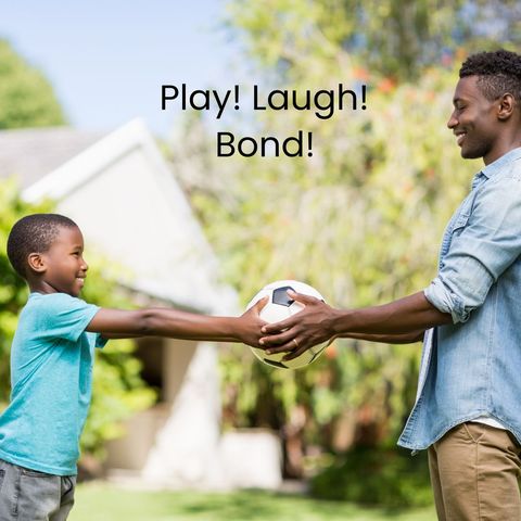 Father and son bonding with soccer ball in sunny yard