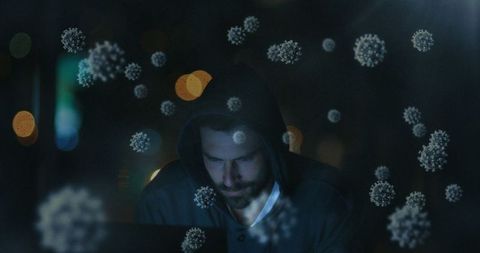 Cybersecurity Hacker Working with Virus Particle Overlays