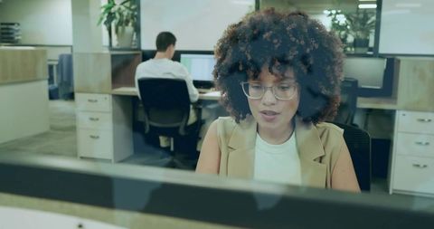 Focused Businesswoman Typing at Office Desk Modern Workspace