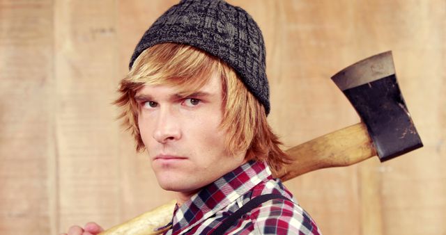 Young Man Carrying Axe in Lumberjack Style Attire - Download Free Stock Images Pikwizard.com