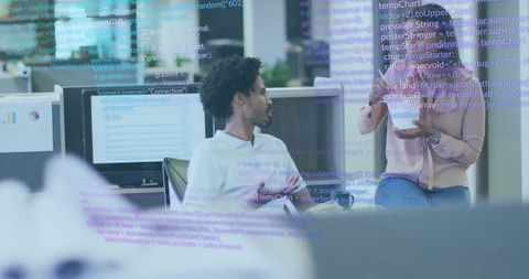 Collaborating on code and analytics in modern open office with monitors and tablets