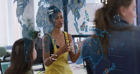 Diverse Team with World Map and Data Overlay in Modern Office