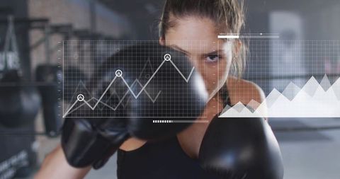 Female Boxer Throwing Punch with Digital Performance HUD and Analytics Overlay in Gym