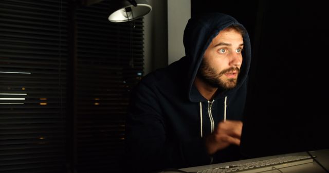 Suspicious Man in Hoodie Typing in Dark Room at Night - Download Free Stock Images Pikwizard.com
